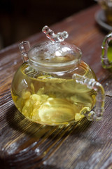 glass teapot and mug on the wooden background - 276016698
