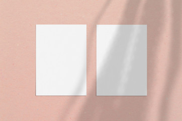 Blank white vertical paper sheet 5x7 inches with shadow overlay. Modern and stylish greeting card or wedding invitation mock up.