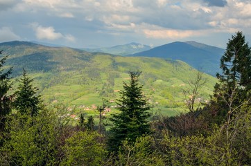 Beautiful spring green landscape. View of the charming villages in the mountains.