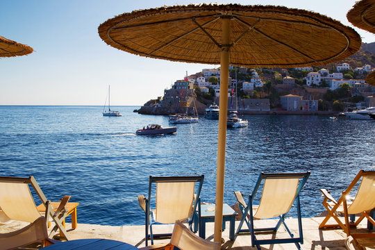 beach chairs and  thatched   roof awnings   on  greek  island