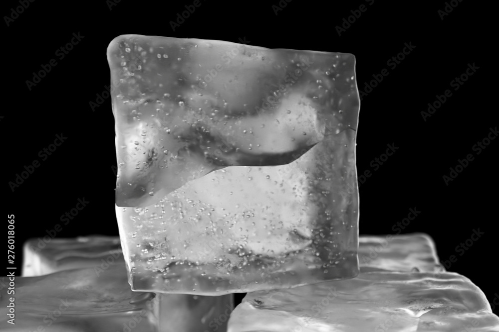 Poster looping rotation of ice cubes on a black isolated background with depth of field. 3d illustration