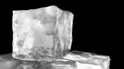 Looping rotation of ice cubes on a black isolated background with depth of field. 3d illustration