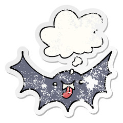 cartoon vampire bat and thought bubble as a distressed worn sticker