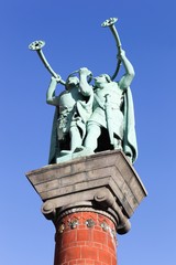 Fototapeta na wymiar The lur blowers statue near the city hall in Copenhagen, Denmark
