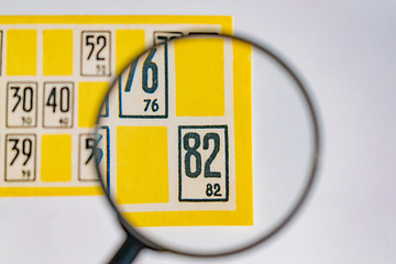 Examination of the card with numbers through the lens