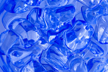 Abstract picture of shiny blue crystals in water