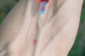 Type of medical syringe with red liquid