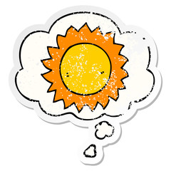 cartoon sun and thought bubble as a distressed worn sticker