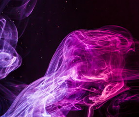 Colored smoke on black background