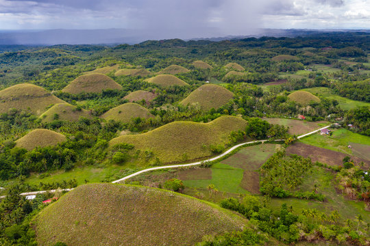 Aerial view of farmland and conical limestone karsts in the unique Chocolate Hills of Bohol, Philippines