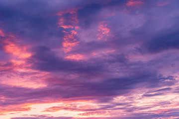 Naklejka na ściany i meble Amazing cloudscape on the sky at sunset time after rain.