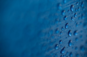 Drops of water on a blue background. Abstract background.