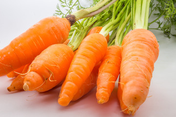 fresh carrots bunch on rustic wooden background