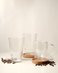 coffee glass mock up with coffee beans on wooden background and copy space.