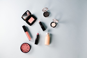 Beauty background for makeup cosmetic product on pastel light blue desktop background. top view, flat lay.
