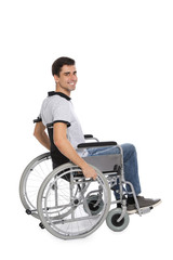 Fototapeta na wymiar Handsome young man in wheelchair isolated on white