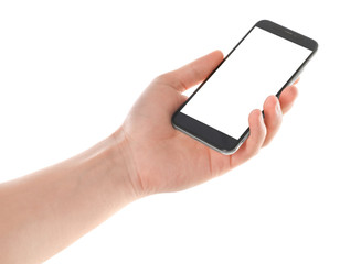 Man holding smartphone with blank screen on white background, closeup of hand. Space for text