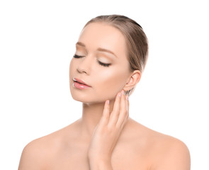 Portrait of young woman with beautiful face on white background