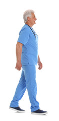 Full length portrait of male doctor in scrubs with stethoscope isolated on white. Medical staff