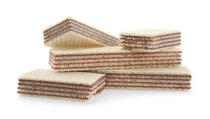 Delicious wafer sticks with chocolate filling isolated on white