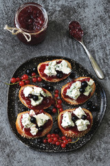 Toasts with currant jam and blue cheese.