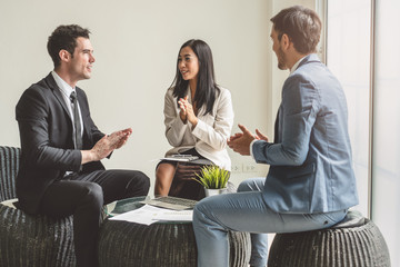 Business team casual meeting and discussing in workplace.