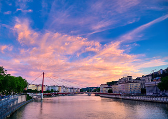 Fototapeta premium A view of Lyon, France along the Saône river at sunset.