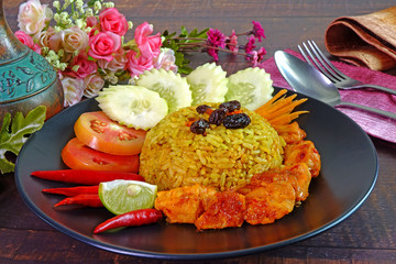 Briyani rice with Sweet spicy chicken curry (Nasi Briyani dengan Ayam Masak Merah), the famous Malaysian cuisine. Halal food, selective fous.