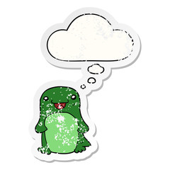 cartoon penguin and thought bubble as a distressed worn sticker