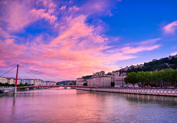 A view of Lyon, France along the Saône river at sunset.