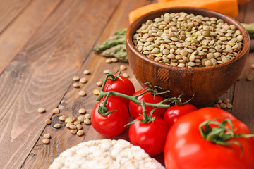 Different healthy food on wooden table
