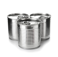 Tin cans with food on color background
