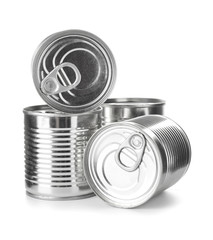 Tin cans with food on color background