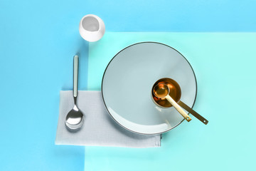 New tableware on color background