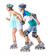 Teenagers on roller skates against white background © Pixel-Shot
