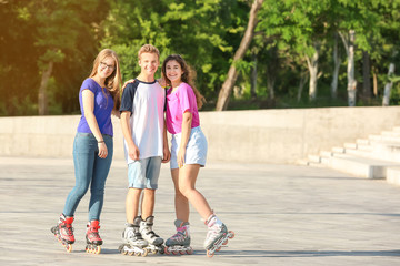 Teenagers on roller skates outdoors