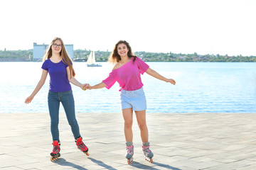 Teenagers on roller skates outdoors