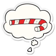 cartoon candy cane and thought bubble as a printed sticker