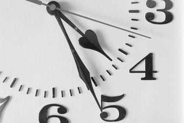 Black and white tone, Close up image of Clock face with clock needle at four o’clock