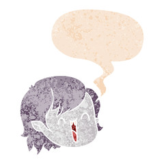 cartoon vampire girl face and speech bubble in retro textured style