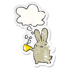 cute cartoon rabbit drinking coffee and thought bubble as a distressed worn sticker