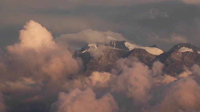 Mountain peaks above moving clouds timeplase