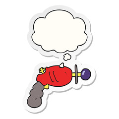 cartoon ray gun and thought bubble as a printed sticker