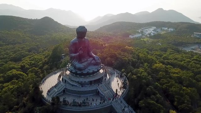 Aerial: Giant Statue of Buddha and Green Trees on Lantau Island, Hong Kong