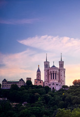 Lyon, France and the Basilica of Notre-Dame de Fourvière at sunset.