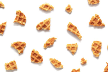 Waffle texture. Wafer cone pieces isolated on white background.