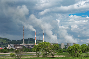 Obraz premium combined heat and power plant on the river
