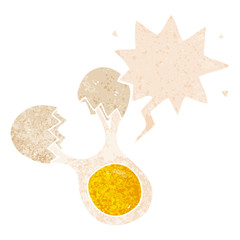 cartoon cracked egg and speech bubble in retro textured style
