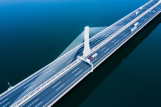 Aerial view of bridge road and cars