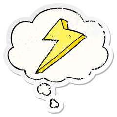 cartoon lightning and thought bubble as a distressed worn sticker